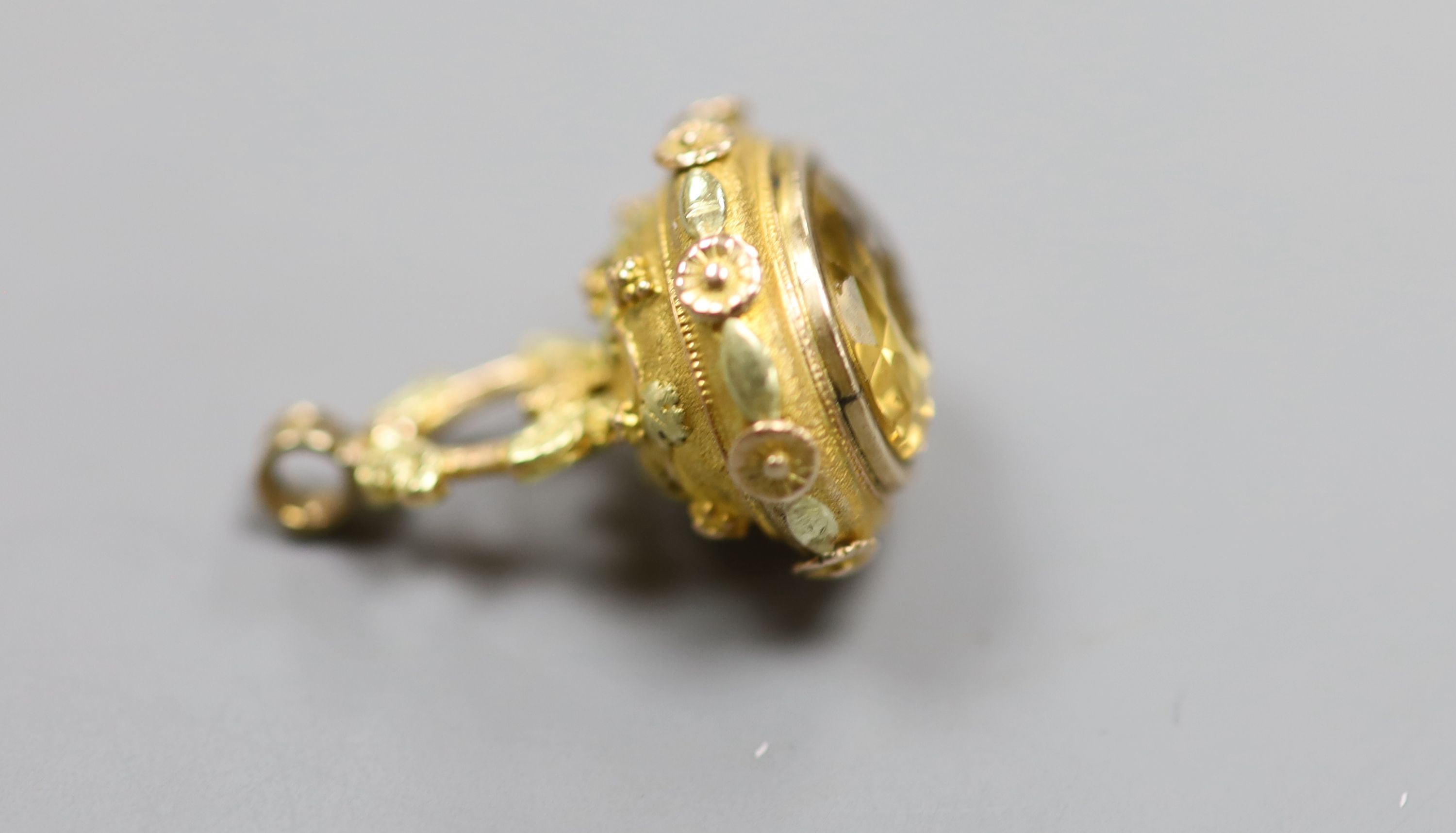A 19th century three colour yellow metal and citrine set fob seal, the matrix carved with crest
